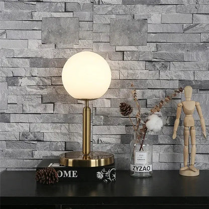 Gold-finished ball table lamp with frosted glass globe shade for bedroom decorbites glass ball table