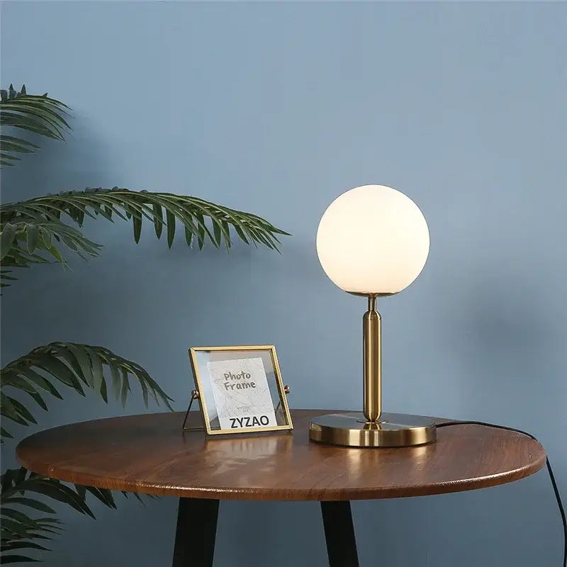 Sleek brass decorbites glass ball table lamp with gold tone and frosted globe shade for stylish bedroom decorbites glass ball