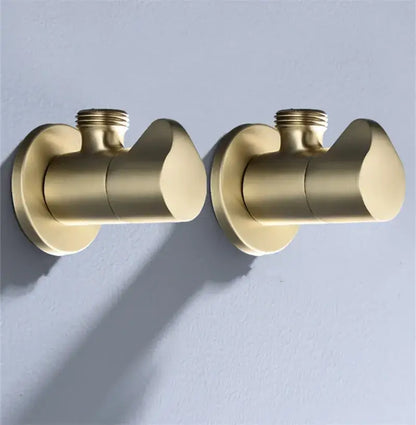 Pair of brushed gold corner valve water control taps with sleek modern design for bathroom installation