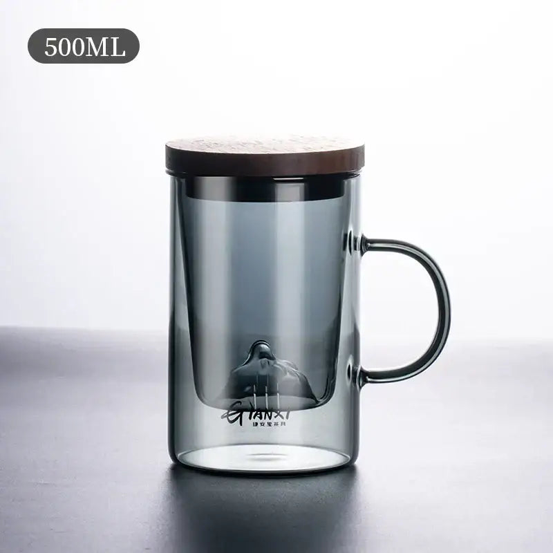 Sleek dark gray double walled glass tea cup with wooden lid and integrated infuser for perfect brewing