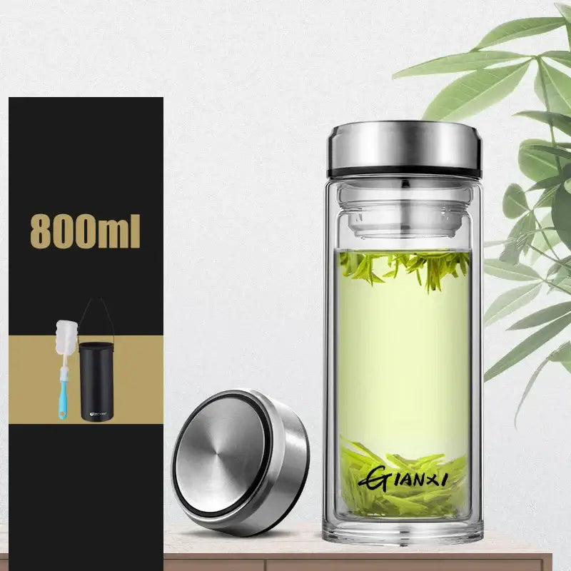 Sleek clear double-walled glass water bottle with silver stainless steel lid and base featuring gianxi logo