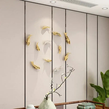 Sleek goldfish resin wall hanging in gold and silver colors for living room decor by decorbites goldfish resin wall