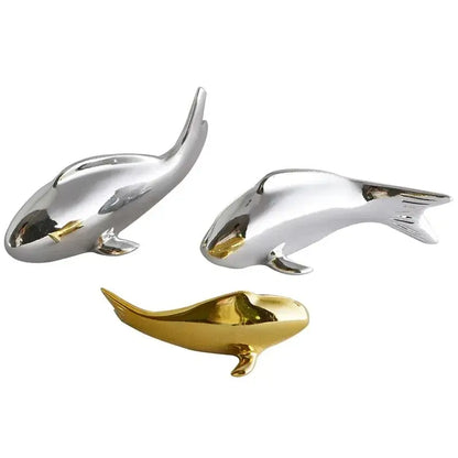 Shiny metallic dolphin figurines in silver and gold finishes complement decorbites goldfish resin wall hanging decorbites goldfish resin wall