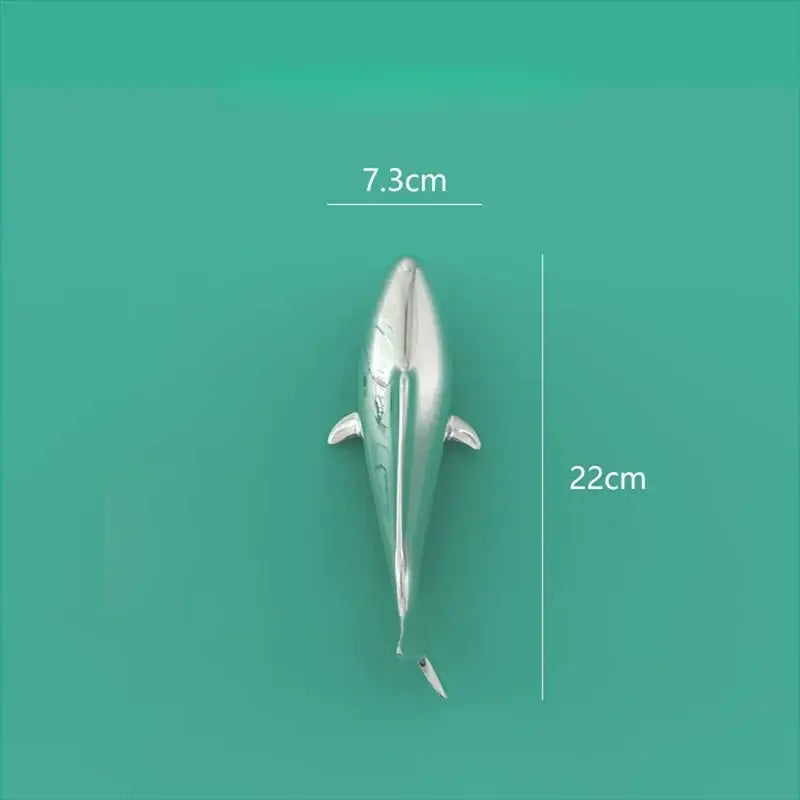 Silver metallic dolphin figurine with sleek reflective surface and detailed fins complementing decorbites goldfish resin wall hanging decor