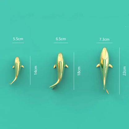 Three sleek metallic golden shark wall hanging decor pieces in varying sizes for decorbites goldfish resin wall display