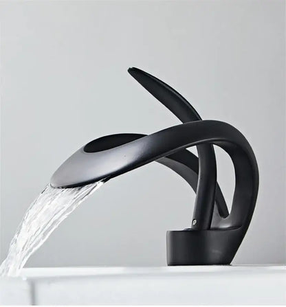 Sleek matte black brass basin faucet with modern waterfall design for bathroom by decorbites black brass