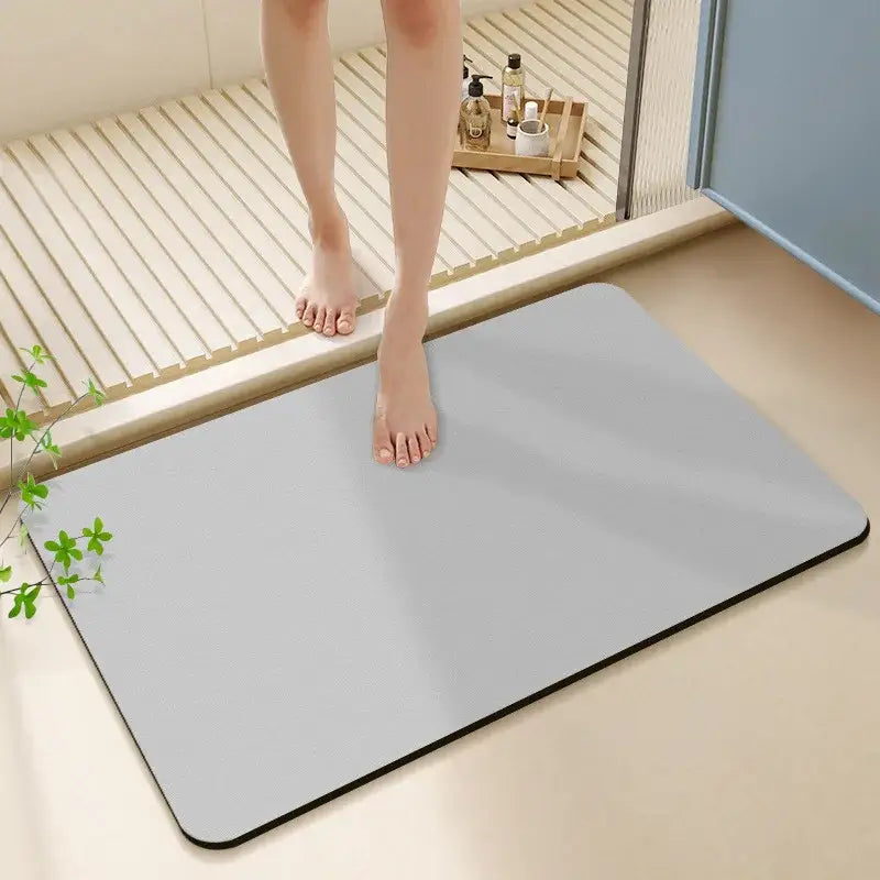 Sleek light gray diatom ooze bath rug with black border and rounded corners for non-slip bathroom use