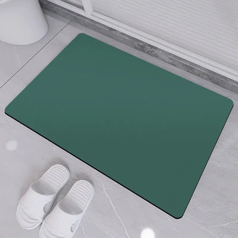 Sleek sage green diatom ooze bath rug with smooth non-slip surface and rounded corners for bathroom use