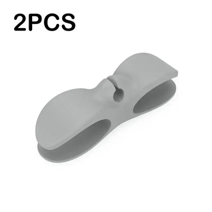 Gray silicone decorbites cord winder cable organizer with sleek ergonomic design and two rounded openings for secure grip