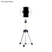 Sleek silver and white circular fill-in lamp with a white ring light mounted on a silver tripod and black phone clamp
