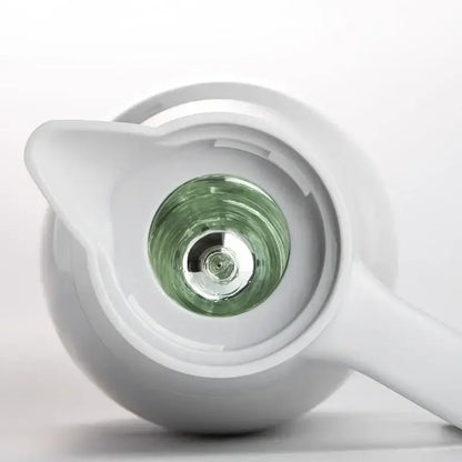 White ceramic teapot with translucent green glass chamber paired with sleek silver stainless steel decorbites insulavacuum bottle