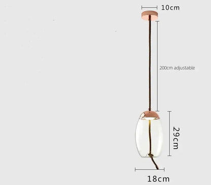 A sleek smoked glass led chandelier pendant light with copper metal accents and dark brown braided cord suspension