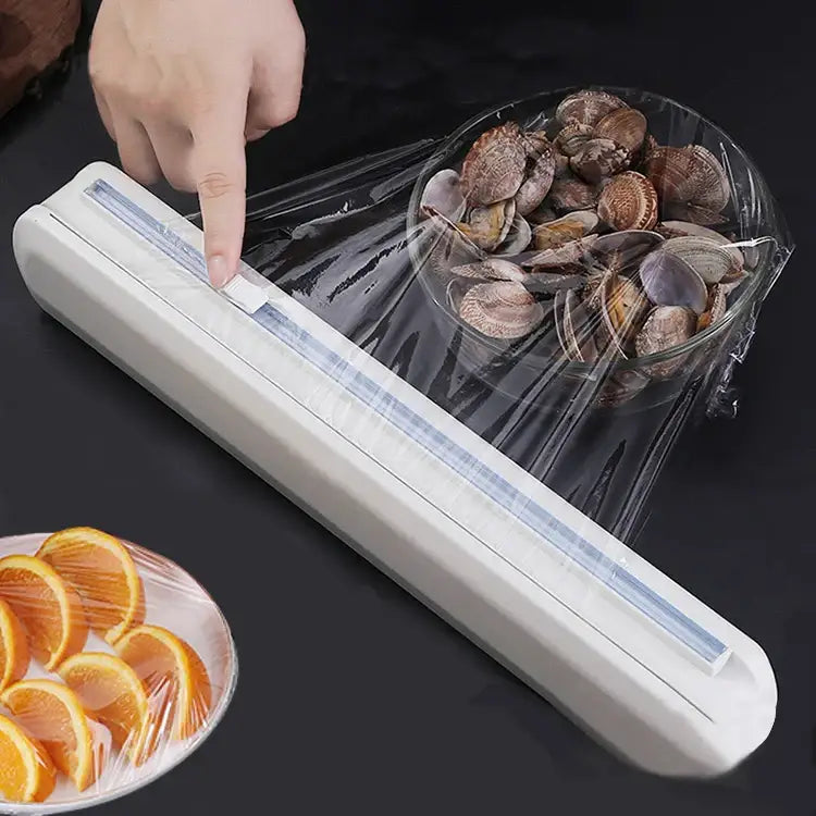 Sleek white plastic cling film dispenser cutter with transparent roll compartment for kitchen food wrap storage