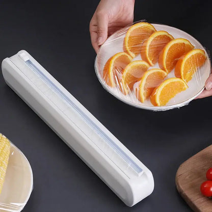 Sleek white plastic cling film dispenser cutter with clear sliding mechanism for kitchen food wrap storage and easy use