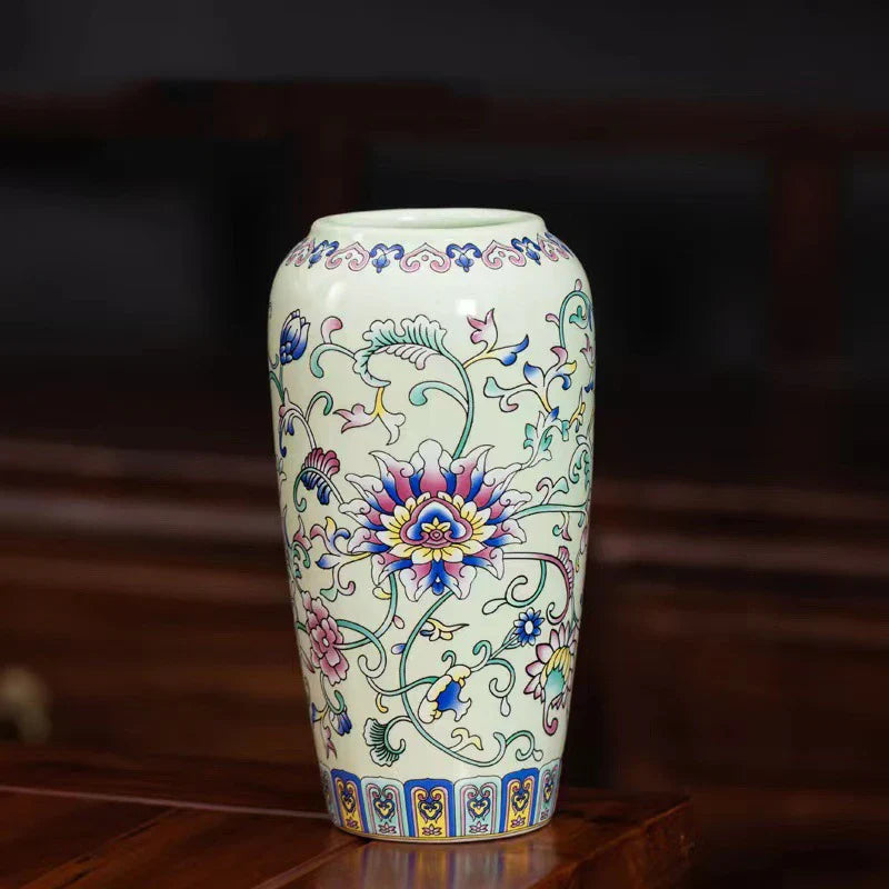 Small ceramic vase with vibrant floral patterns in pink blue and green on cream off-white enamel glazed porcelain for decor