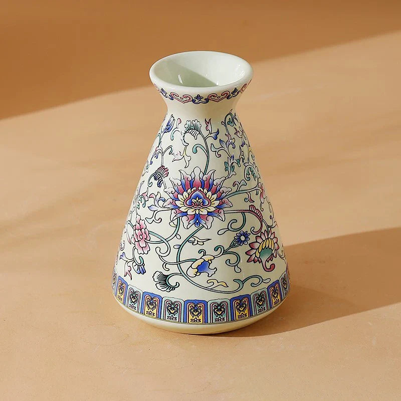 A small white ceramic vase with blue pink and purple floral patterns handmade vintage Chinese enamel porcelain decor