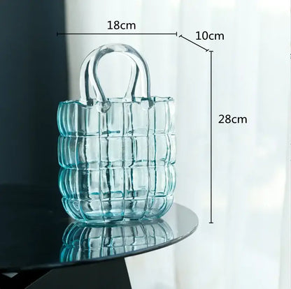 A translucent light blue quilted glass tote bag with clear handle featured as decorbites clear glass vase living room decor