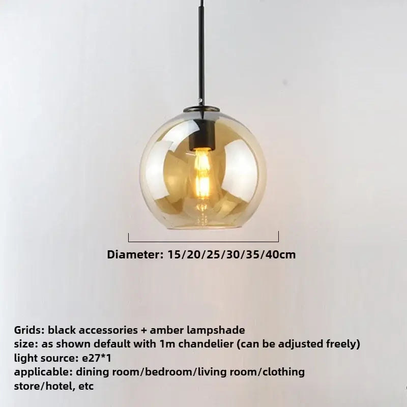 A modern smoky gray pendant light with five amber glass globes and black iron finish hardware as a dining room light source