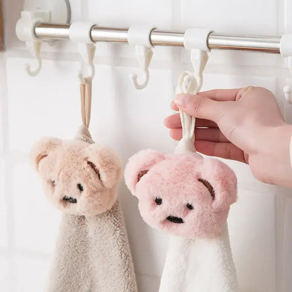 Soft cartoon bear hand towels in pink and beige microfiber with plush texture hanging on hooks decorbites cartoon bear