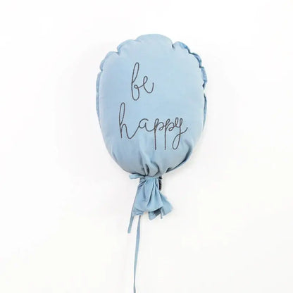 Light blue cotton balloon wall hanging cushion embroidered with be happy in black cursive for kids room decor