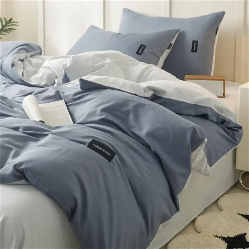 Soft cream cotton bedding set with blue and white duvet featuring textured fabric and black brand tags decorbites cotton bedding