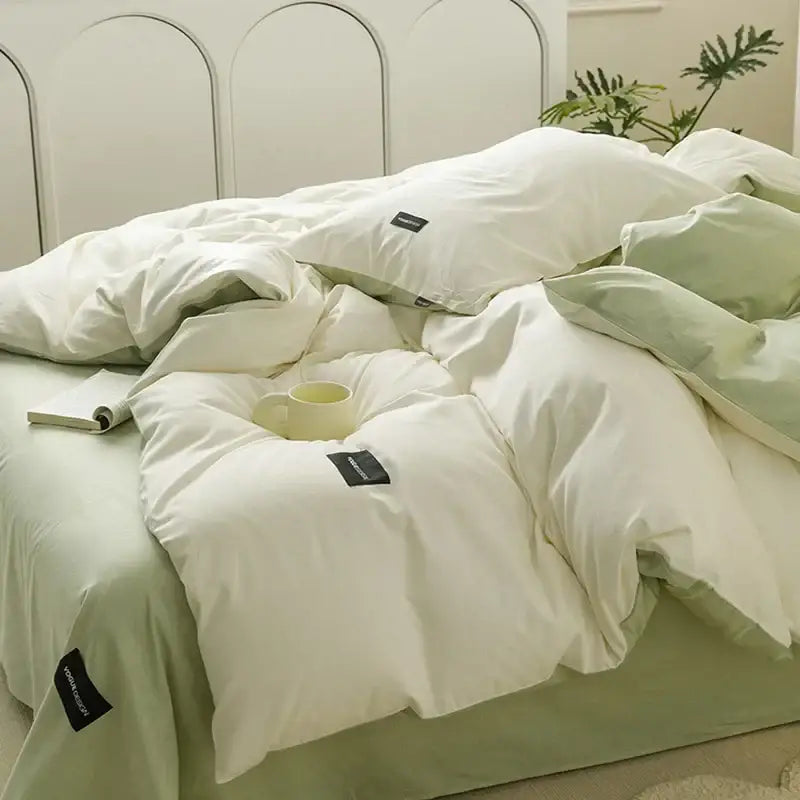 Soft cream cotton bedding set with pale green duvet and subtle texture featuring black decorbites cotton bedding tags