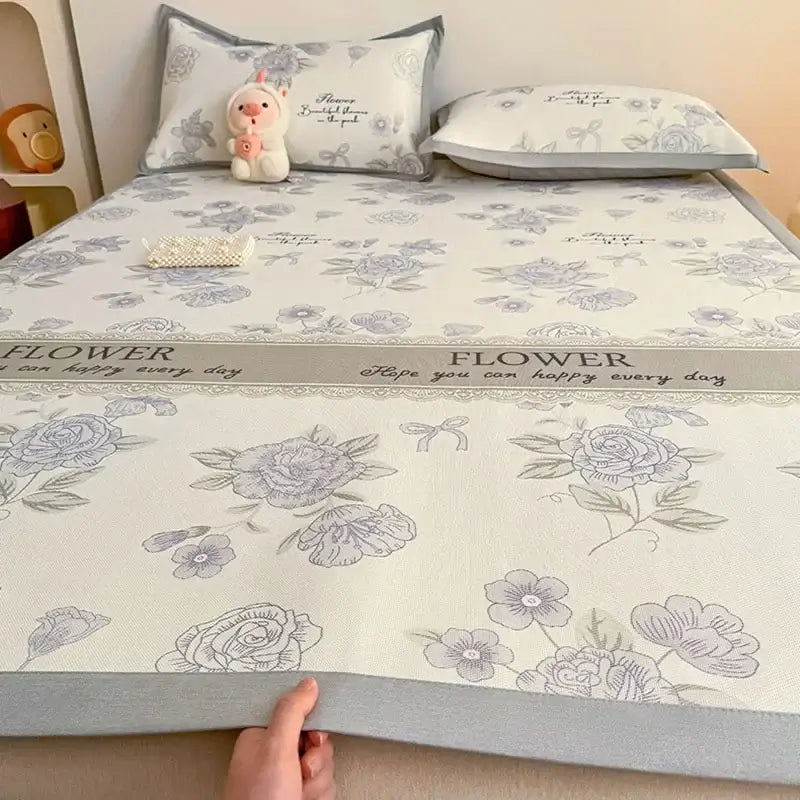 Soft gray floral antibacterial pattern mattress set featuring an off-white bed pad with gray roses and a central band