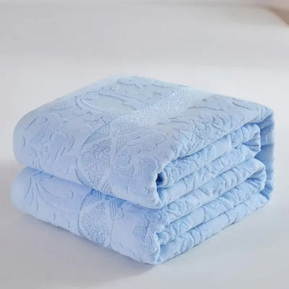 Soft pastel light blue decorbites cotton jacquard towel blanket with subtle floral pattern for bedroom and sofa decor