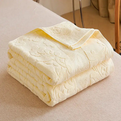 Soft pastel pale yellow decorbites cotton jacquard towel blanket with raised floral pattern and plush texture