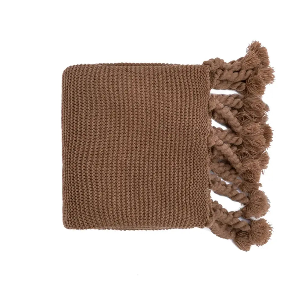 A cozy earthy brown decorbites knit throw blanket with textured weave and tassels for soft plaid decor accents