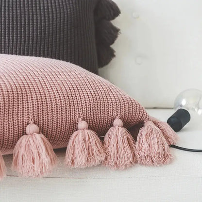 Soft pink knit cushion cover with fluffy tassels, a decorbites knit cushion perfect for living room decor
