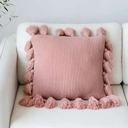 Soft pink knit cushion cover with fluffy tassels for living room decor featuring decorbites knit cushion design