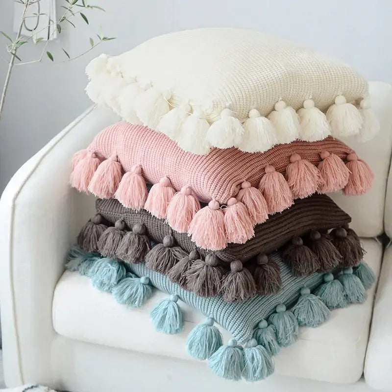 Stack of four pastel-colored soft tassel knit cushion covers with fluffy tassels for living room decorbites knit cushion