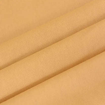 Soft yellow and beige cotton fitted sheet with a smooth textured weave for bedroom decorbites cotton fitted bedding