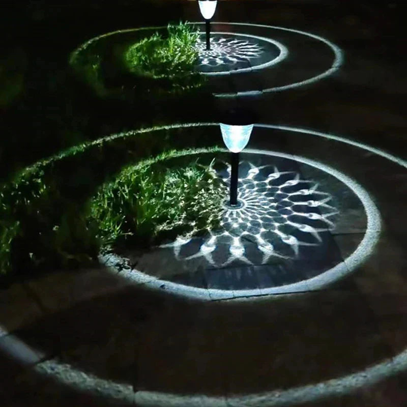 Solar light outdoor waterproof pathway garden lights with sleek black poles and white lampshades casting circular shadows