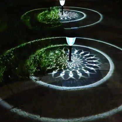 Solar light outdoor waterproof pathway garden lights with sleek black poles and white lampshades casting circle shadows