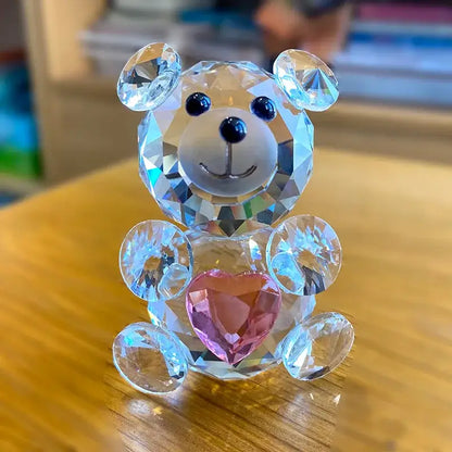 A sparkling crystal bear figurine with black bead eyes and a pink heart gem for bedroom decorbites crystal bear decor