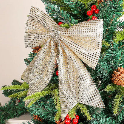 A shimmering gold diamond bow pendant with a sparkling mesh crystal pattern for holiday tree decor