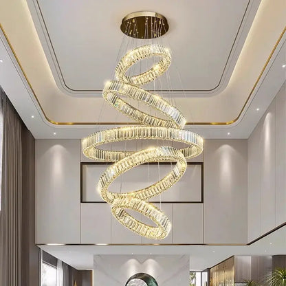 A modern decorbites crystal chandelier pendant light with clear faceted crystal rings and gold ceiling mount for indoor use
