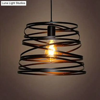 Black wrought iron spiral spring suspension pendant light with exposed edison bulb for black and white dining room