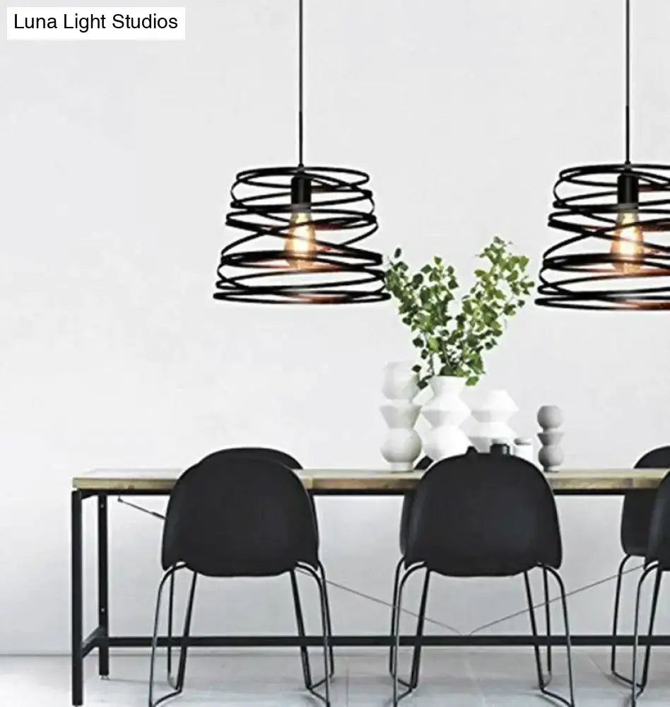 Black spiral spring suspension pendant light with metal frame and exposed filament bulbs for dining room use
