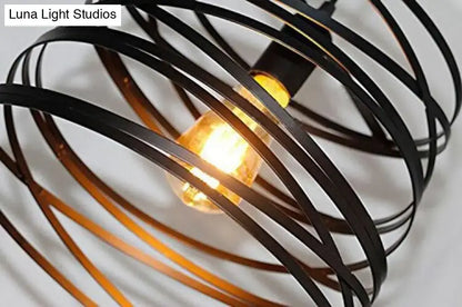 Black wrought iron spiral spring suspension pendant light with warm edison bulb for black and white dining room