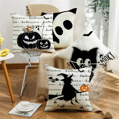 White halloween pumpkin linen throw pillows with black spooky ghost witch and pumpkin designs for living room sofa