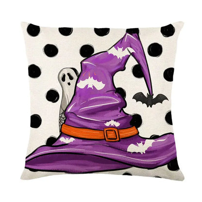 Purple witch hat with orange belt and white bat accents on black and white polka dot halloween pumpkin linen cushion cover