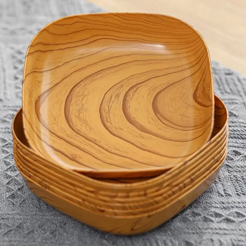 Stack of square imitation wood snack plates with warm natural wood grain finish for dining room serving tray decorbites imitation wood