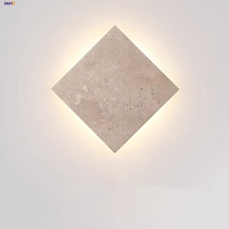 Square yellow travertine led wall lamp sconce with textured beige surface and subtle speckles for stairways lighting