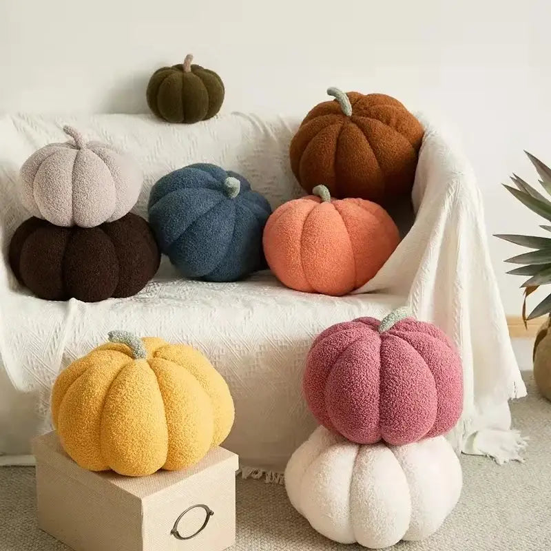 Soft plush stacked 3d pumpkin throw pillow in warm yellow orange pink and blue fleece decor for living room
