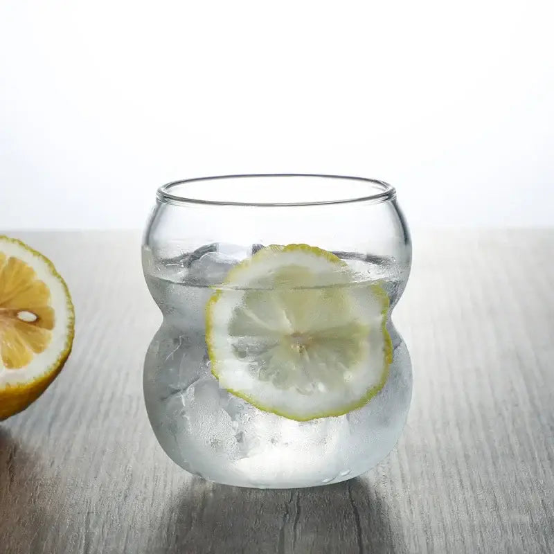 Clear glass cold brew coffee tumbler with stacked ribbed two-part design and ice cubes for brew coffee cup use
