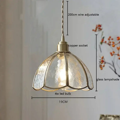 Antique brass-finished pendant light with colorful glass copper shade divided into petal segments for kitchen decorbites