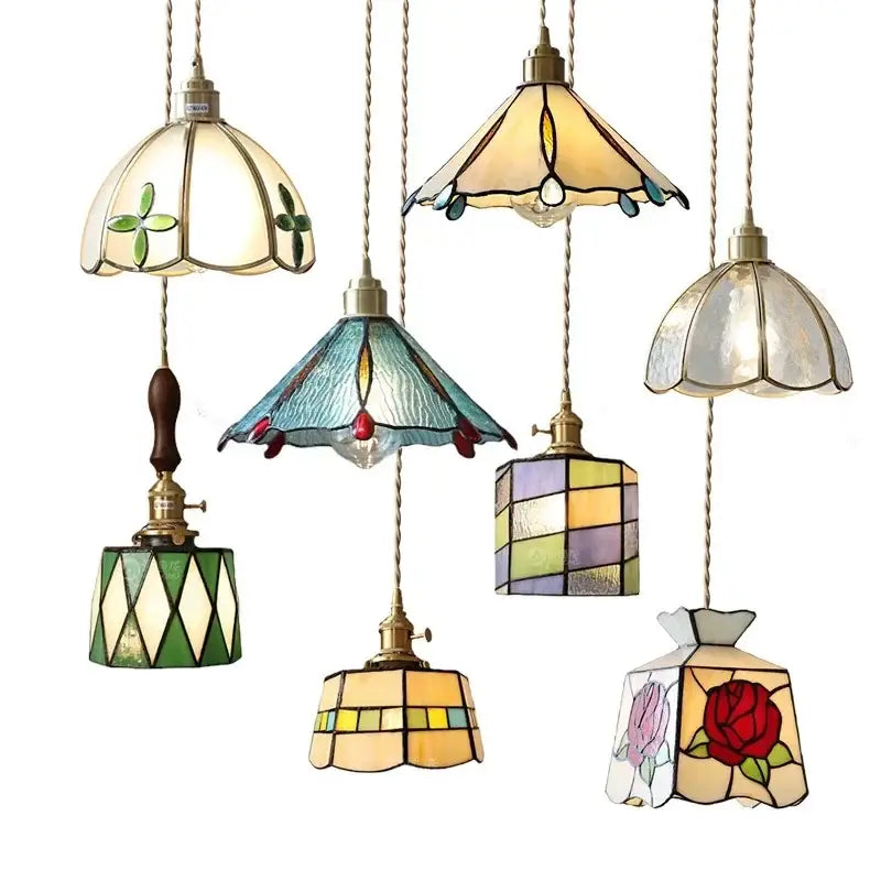 Stained glass floral pendant light with colorful glass copper finish featuring vibrant green blue yellow and red designs